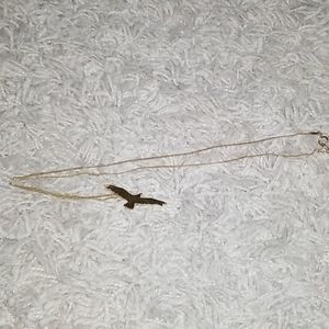 Delicate gold necklace w/soaring bird pendant